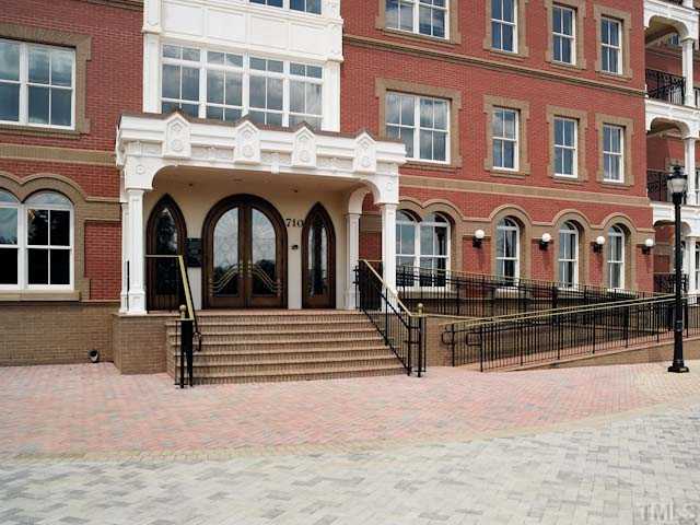 710 Independence Place, Unit 7F Raleigh, NC 27603 - Photo 1 of 3 a front view of a building with a outdoor space