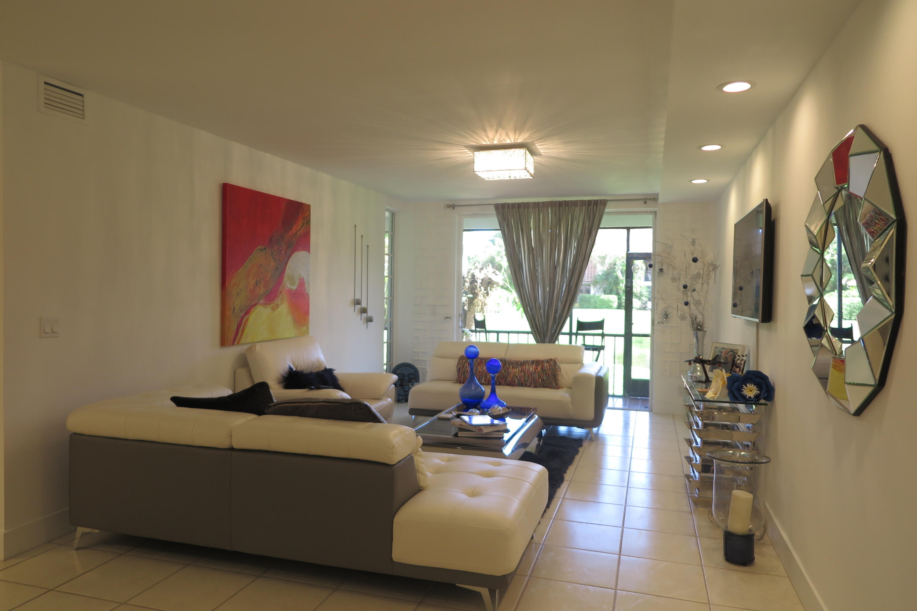 7875 La Mirada Drive Boca Raton, FL 33433 - Photo 6 of 31 a living room with furniture and a large window