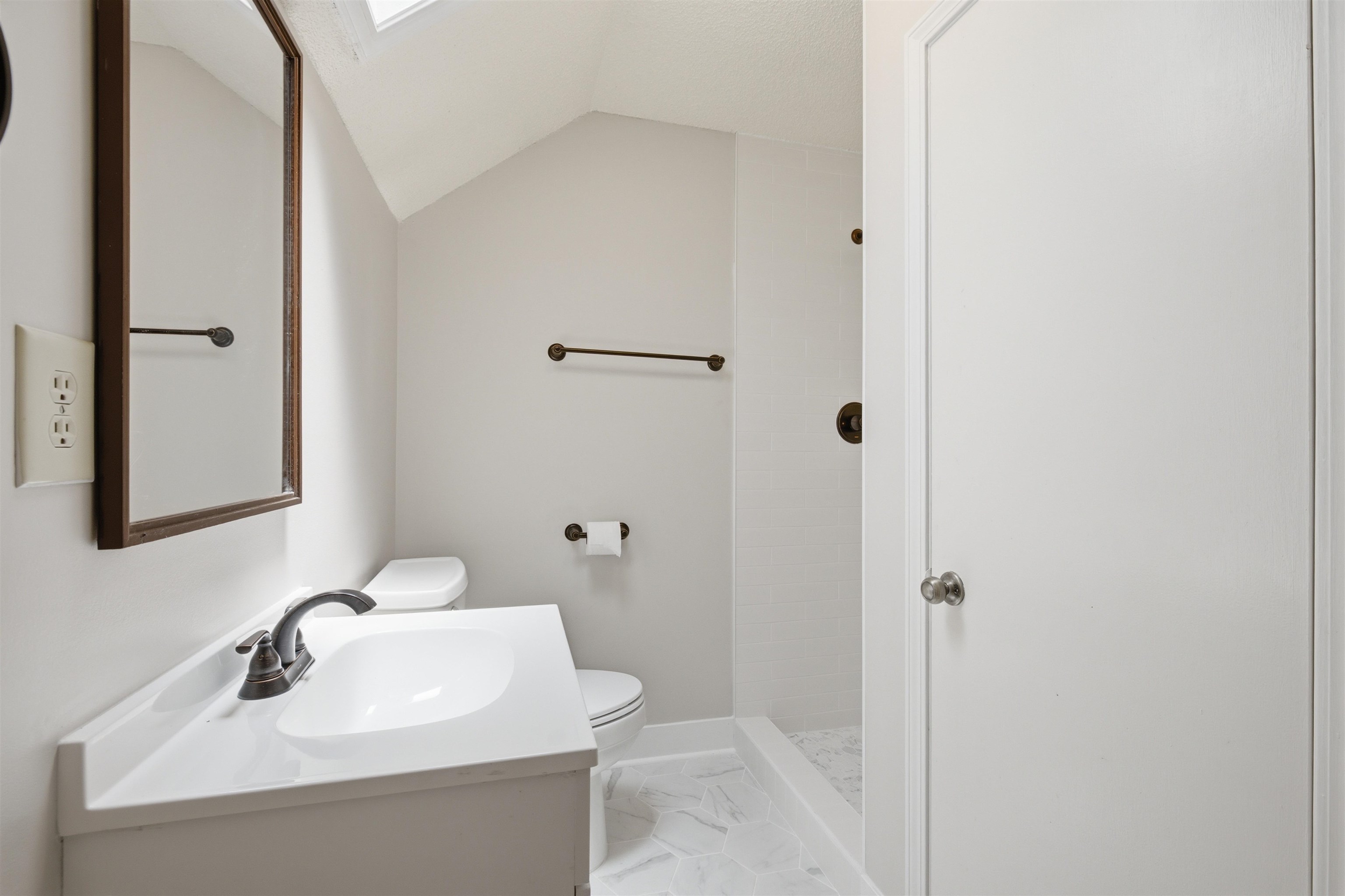 1370 North Reid Hooker Road Eads, TN 38028 - Photo 36 of 39 Bathroom featuring a single vanity with integrated sink, bronze-finish faucet, and coordinating bronze-finish hardware