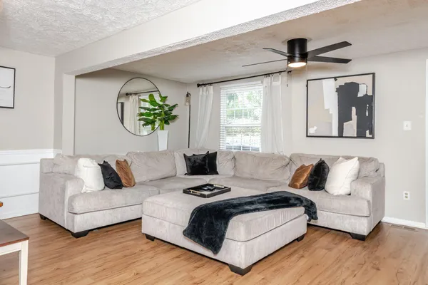 a living room with furniture and a window