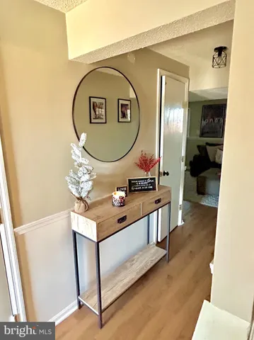 a living room with a sink and a mirror