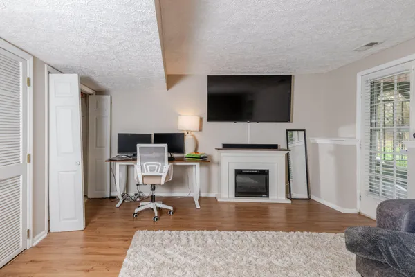 a view of a livingroom with furniture and a fireplace