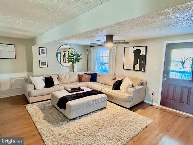 a living room with furniture and a couch