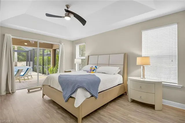 a bedroom with a large bed and a large window