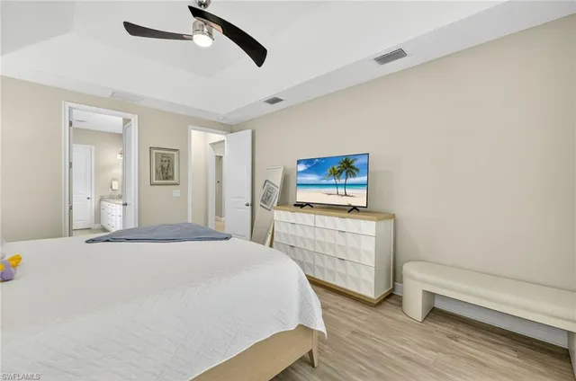 a bedroom with a bed and a dresser