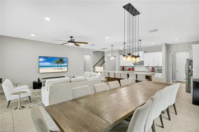 a living room with lots of furniture and a chandelier