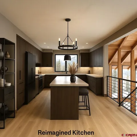 a kitchen with stainless steel appliances a dining table chairs and a wooden floor