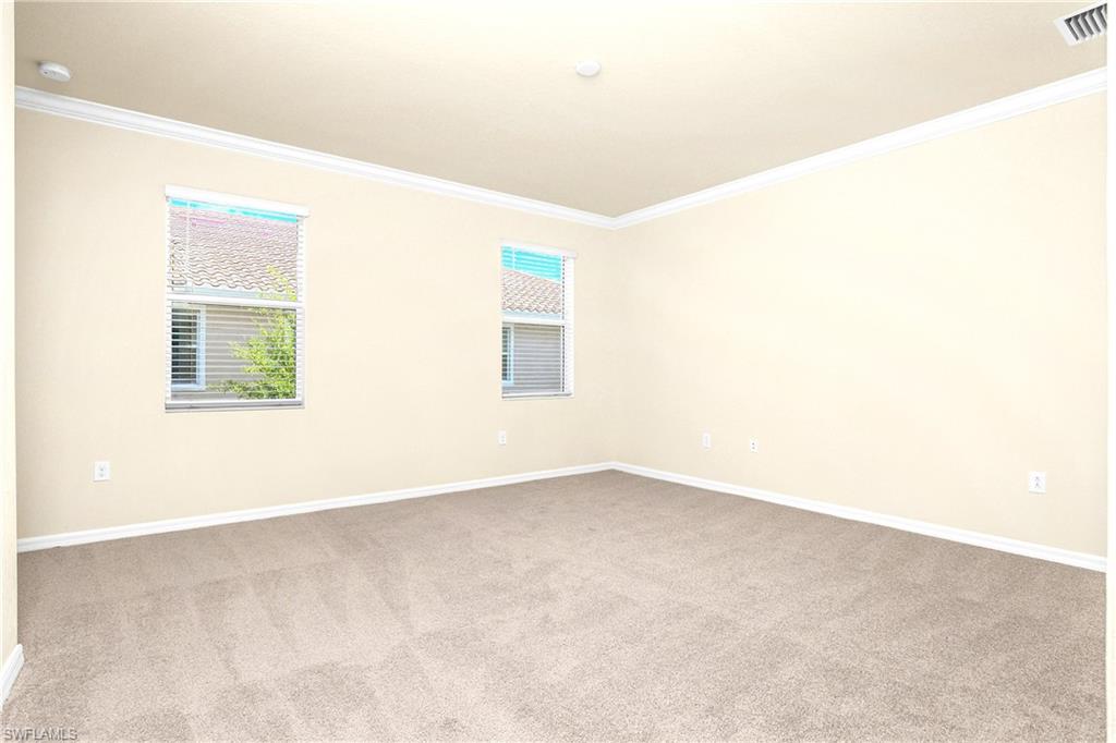 2754 Citrus Street Naples, FL 34120 - Photo 13 of 34 an empty room with windows