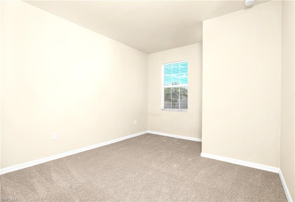 2754 Citrus Street Naples, FL 34120 - Photo 17 of 34 an empty room with windows