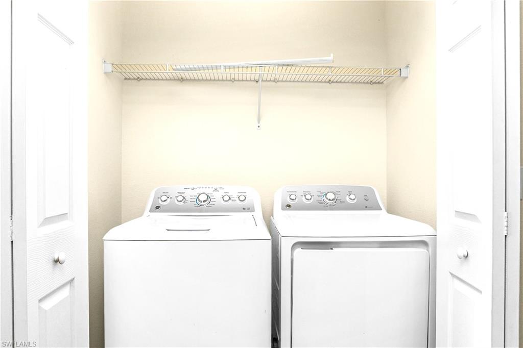 2754 Citrus Street Naples, FL 34120 - Photo 18 of 34 a utility room with dryer and washer