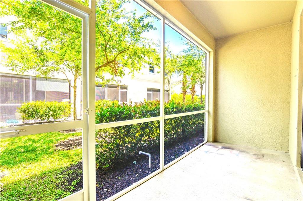 2754 Citrus Street Naples, FL 34120 - Photo 20 of 34 a view of a glass door and a yard from a window