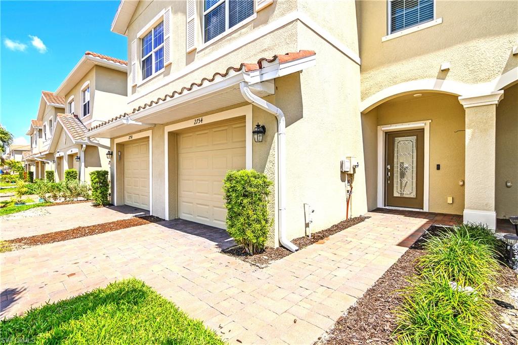 2754 Citrus Street Naples, FL 34120 - Photo 2 of 34 a front view of a house with a porch