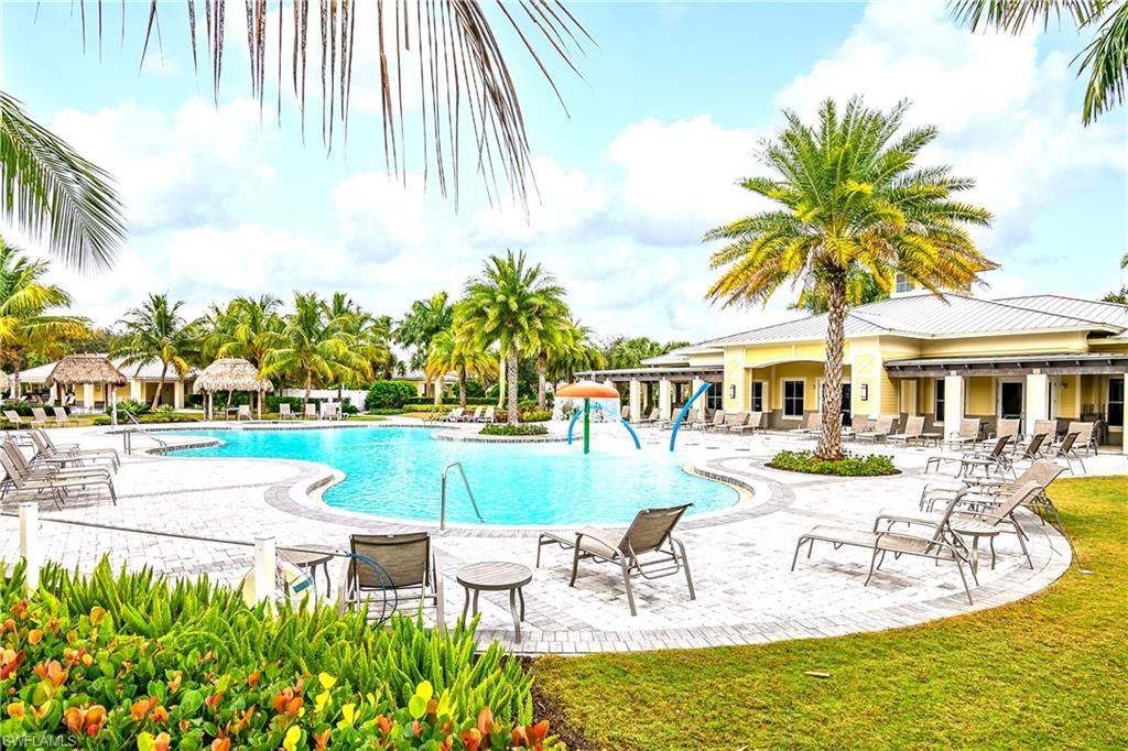 2754 Citrus Street Naples, FL 34120 - Photo 23 of 34 a view of a swimming pool with a patio