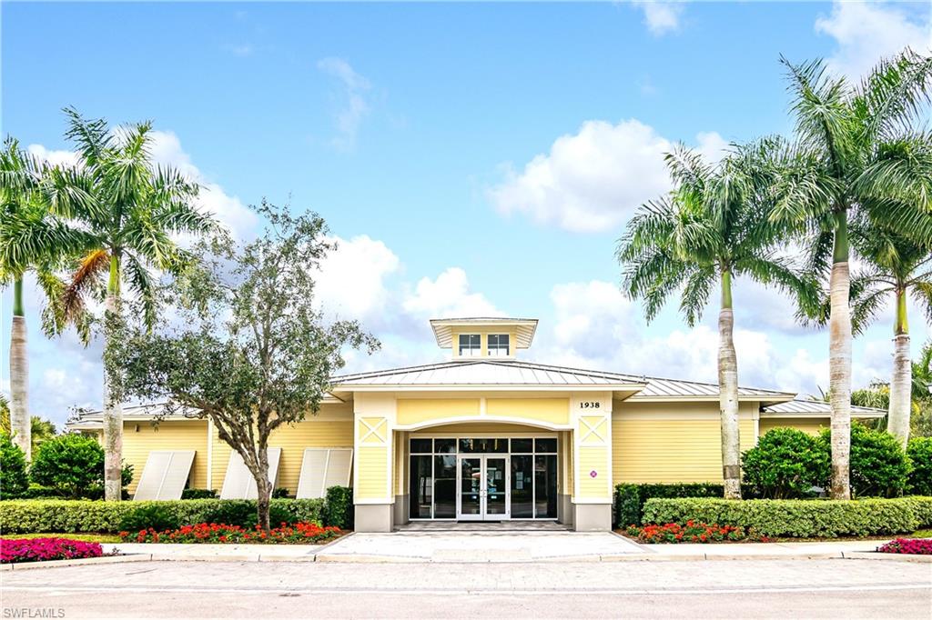2754 Citrus Street Naples, FL 34120 - Photo 29 of 34 a front view of a house with a garden and trees