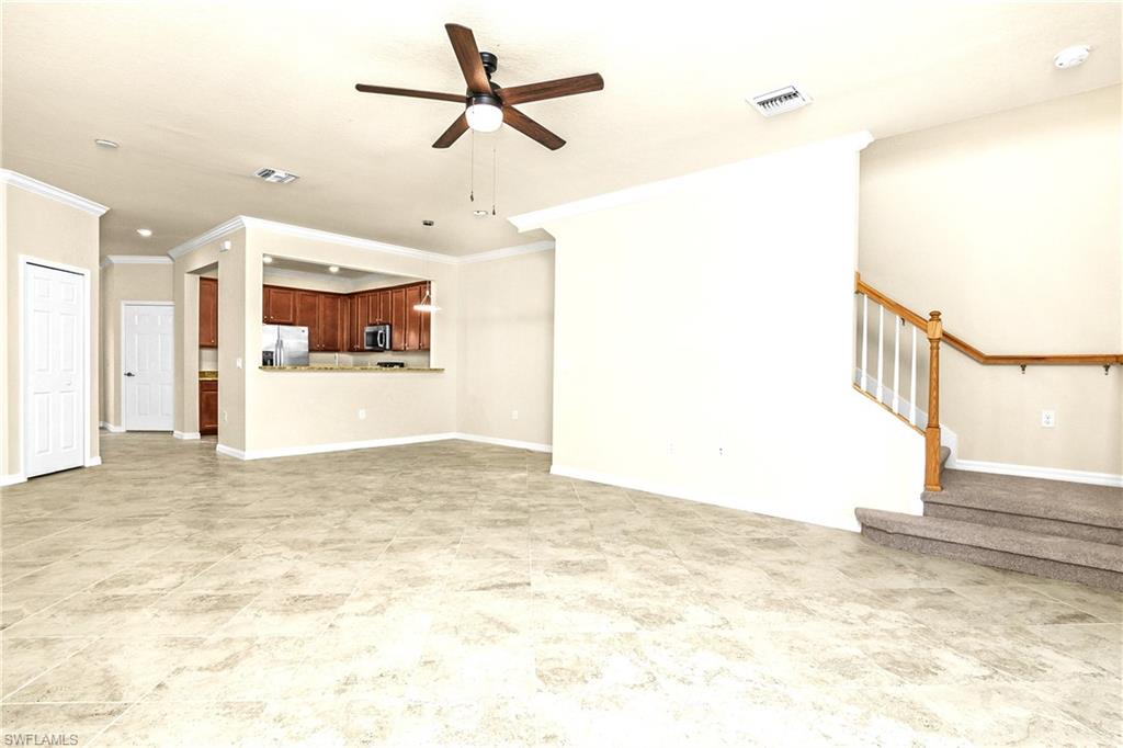 2754 Citrus Street Naples, FL 34120 - Photo 5 of 34 a view of a empty room with a ceiling fan