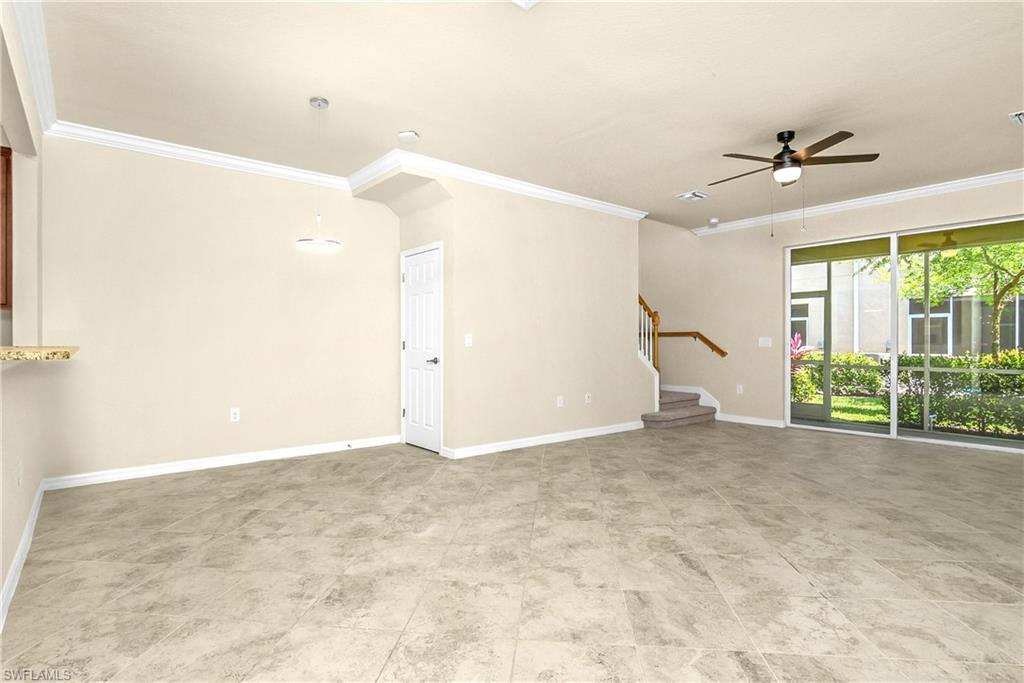2754 Citrus Street Naples, FL 34120 - Photo 6 of 34 a view of a big room with windows and ceiling fan