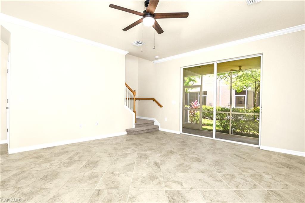 2754 Citrus Street Naples, FL 34120 - Photo 9 of 34 a view of a livingroom with a ceiling fan and window