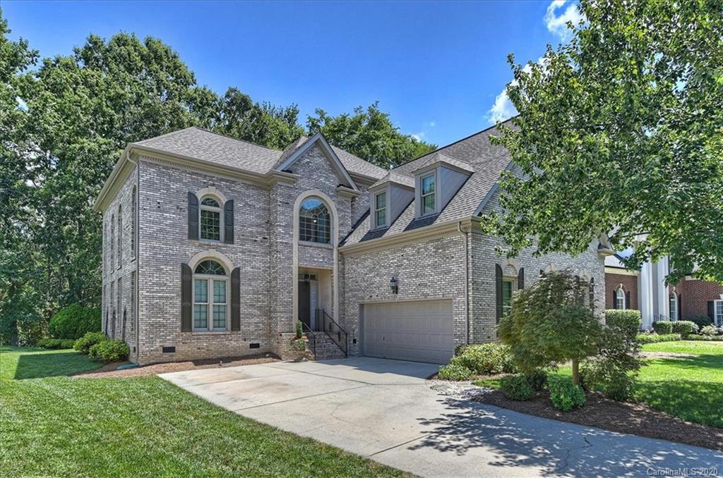 3501 Rhett Butler Place Charlotte, NC 28270 - Photo 1 of 48 a front view of a house with a garden