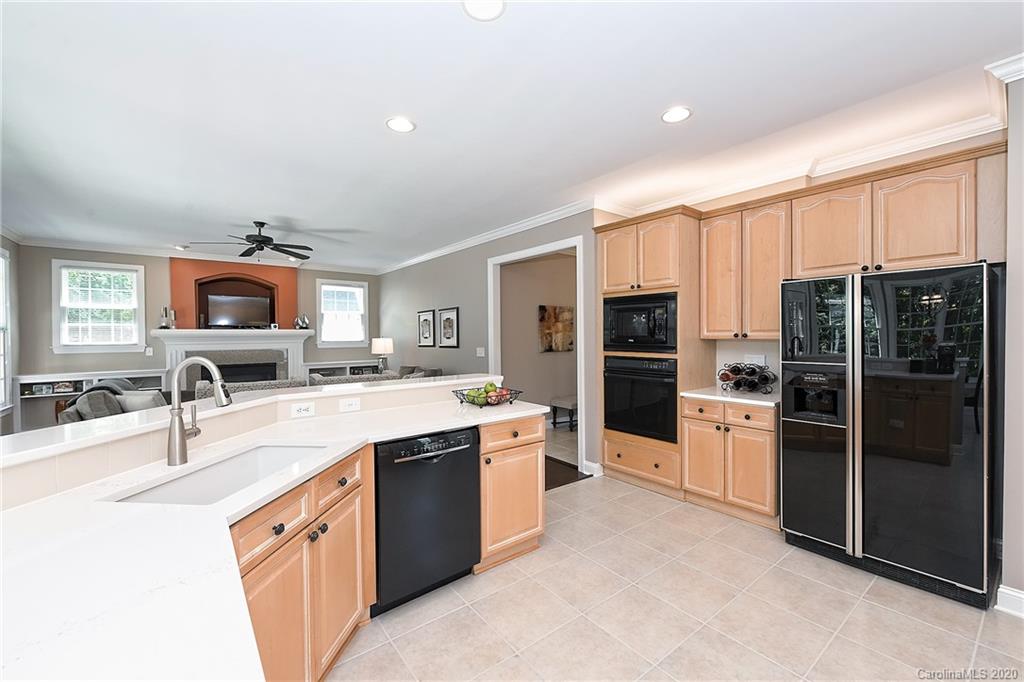 3501 Rhett Butler Place Charlotte, NC 28270 - Photo 13 of 48 a large kitchen with stainless steel appliances granite countertop a refrigerator and a sink