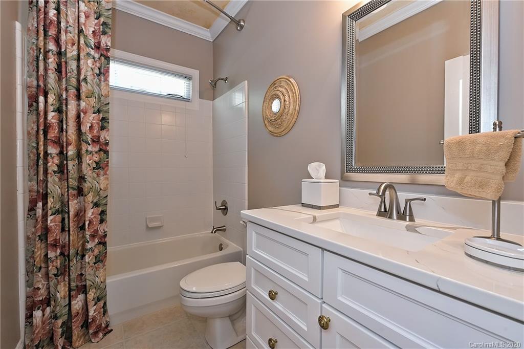 3501 Rhett Butler Place Charlotte, NC 28270 - Photo 20 of 48 a bathroom with a granite countertop toilet sink and mirror