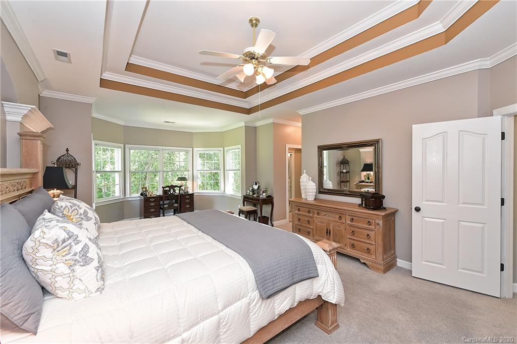 3501 Rhett Butler Place Charlotte, NC 28270 - Photo 26 of 48 a bed room with a bed and a large mirror