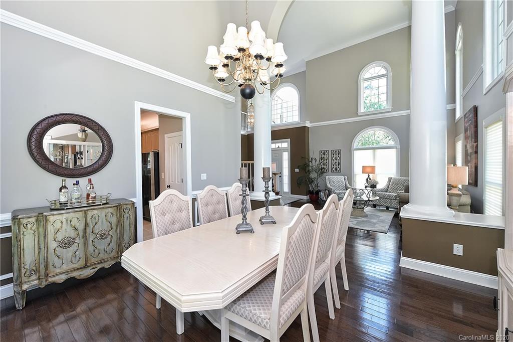 3501 Rhett Butler Place Charlotte, NC 28270 - Photo 7 of 48 a view of a dining room with furniture and a chandelier