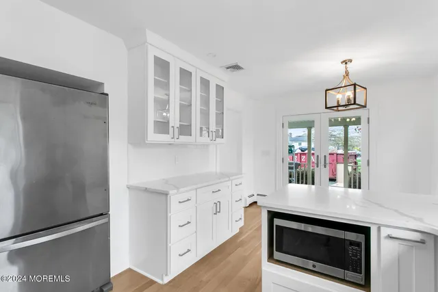 a view of living room with furniture and a fireplace