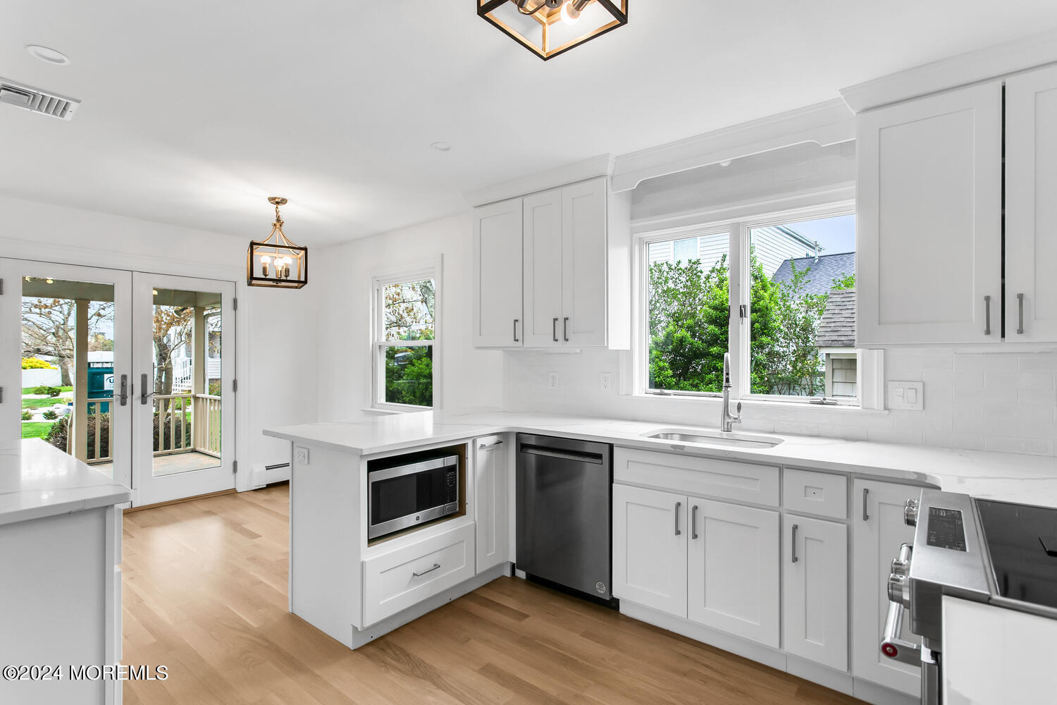 74 Ward Avenue Rumson, NJ 07760 - Photo 4 of 23 a kitchen with a white stove top oven sink and window
