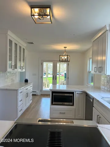 a kitchen with a stove and a sink