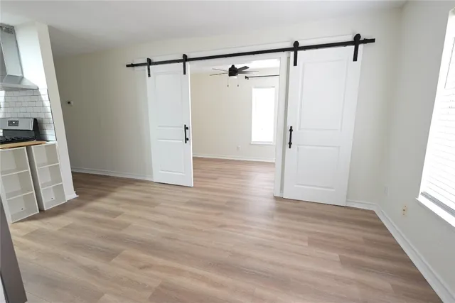 a view of walk in closet with empty racks