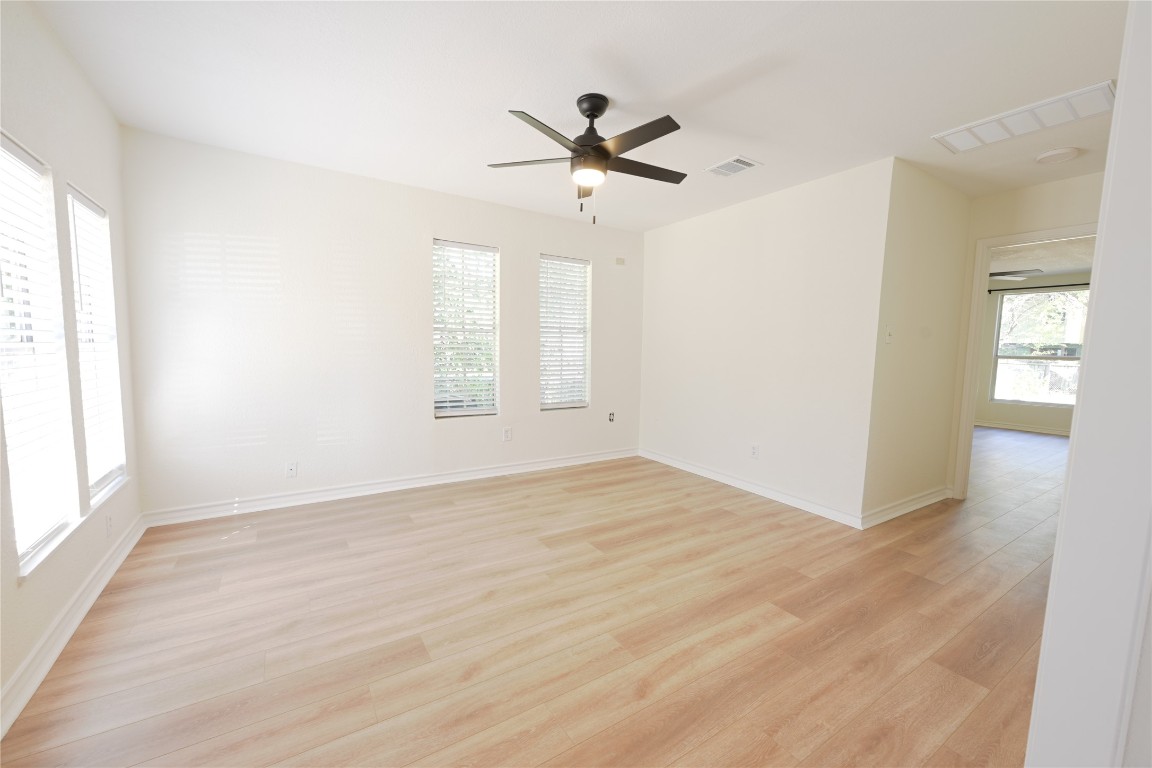 2311 South 3rd Street Austin, TX 78704 - Photo 3 of 14 wooden floor in an empty room with a window