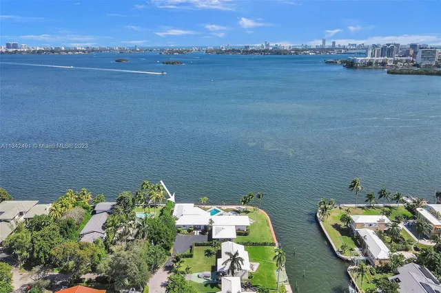 an aerial view of a house with a ocean view