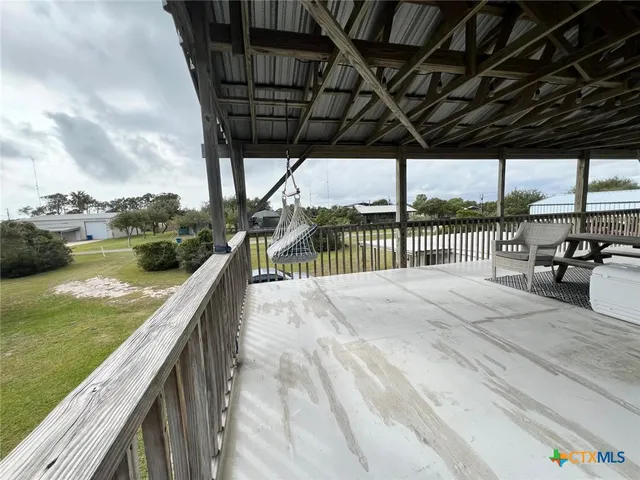 a view of swimming pool with outdoor seating