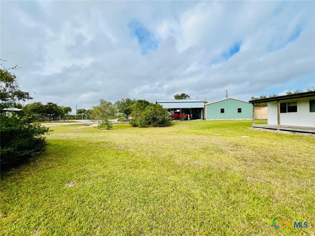 56 Rutherford Street Port O'Connor, TX 77982 - Photo 24 of 37 a view of an ocean with a big yard