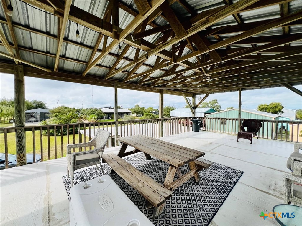 56 Rutherford Street Port O'Connor, TX 77982 - Photo 29 of 37 a view of a patio with couches and pool