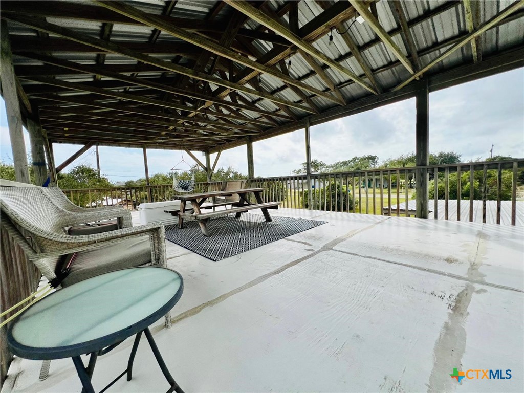 56 Rutherford Street Port O'Connor, TX 77982 - Photo 30 of 37 a building outdoor space with patio lots of furniture