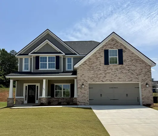 a front view of a house with yard
