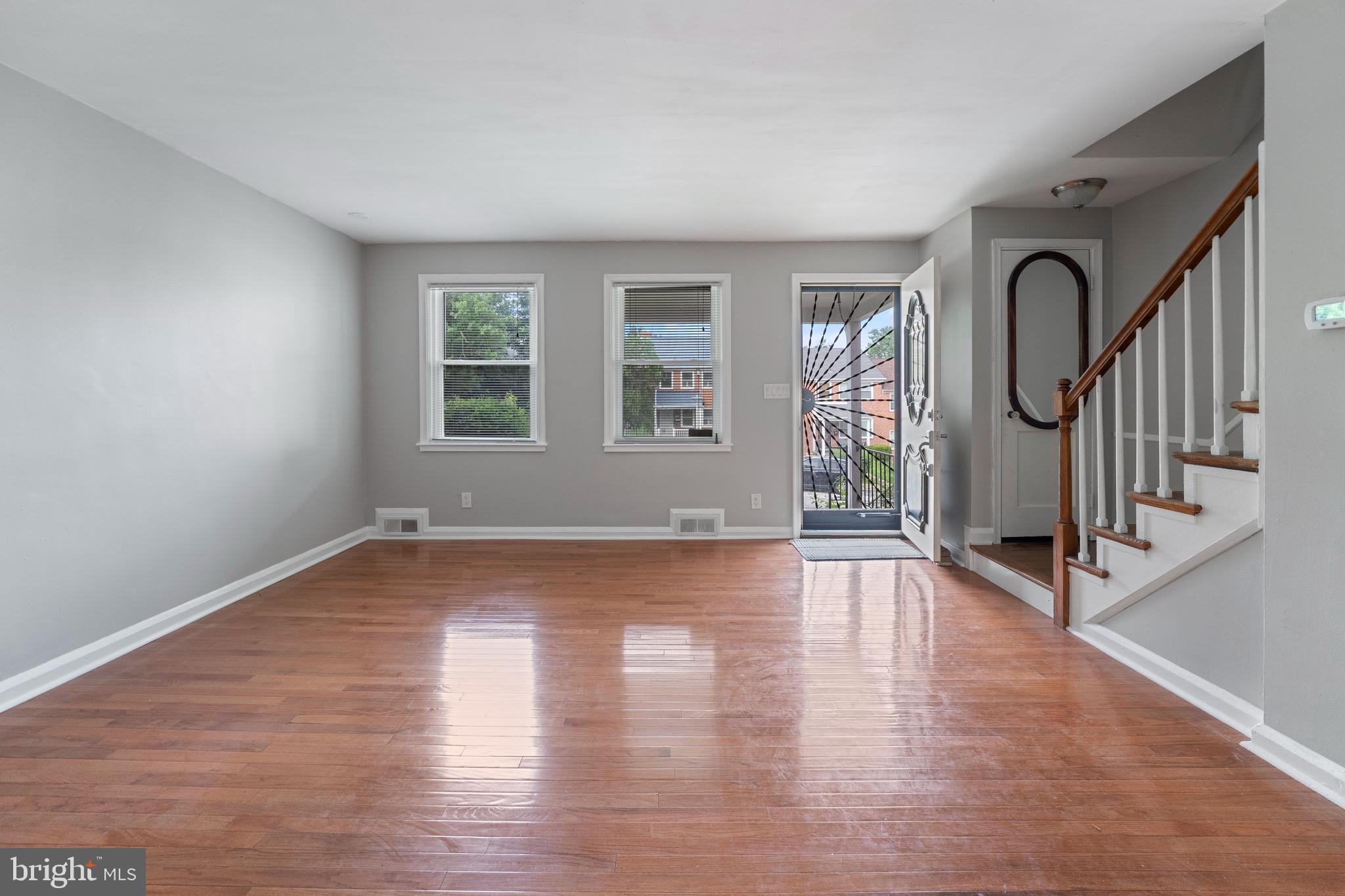 1515 Gleneagle Road Baltimore, MD 21239 - Photo 3 of 27 Spacious living room, beautiful hardwood flooring