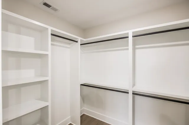 a view of an empty walk in closet