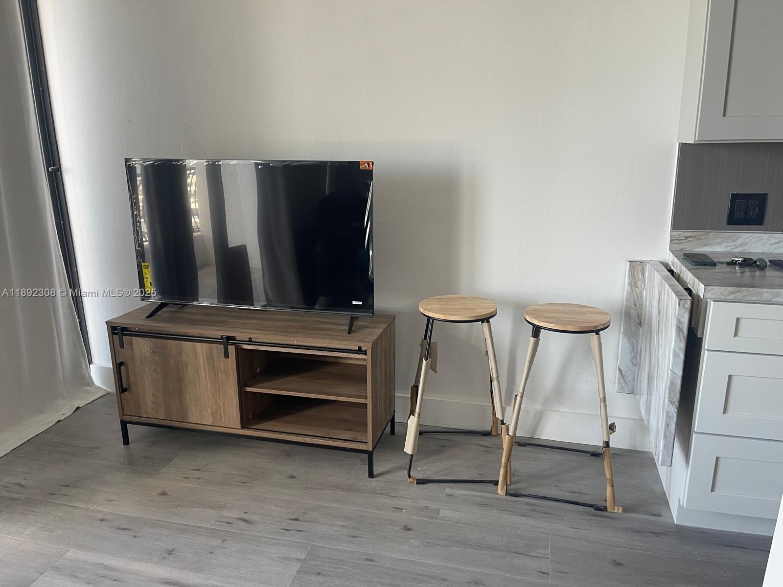 555 Northeast 15th Street, Unit 416 Miami, FL 33132 - Photo 9 of 13 a view of room with furniture