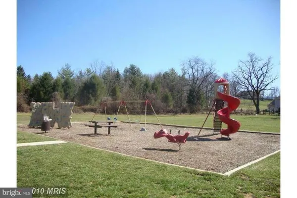 a view of park with a slide