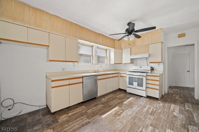 116 Berkeley Avenue Bloomfield, NJ 07003 - Photo 12 of 13 a kitchen with granite countertop a sink cabinets stainless steel appliances and a counter space