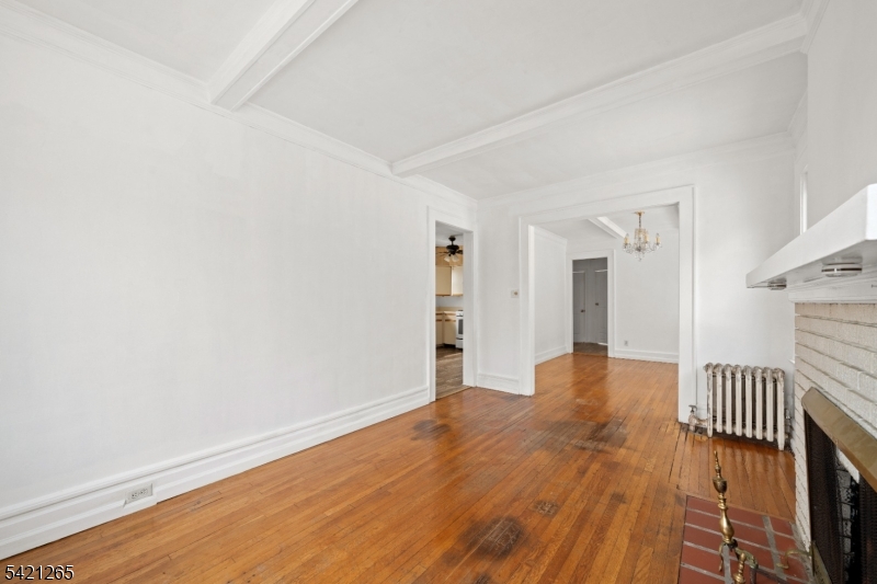 116 Berkeley Avenue Bloomfield, NJ 07003 - Photo 3 of 13 a view of a hallway with wooden floor
