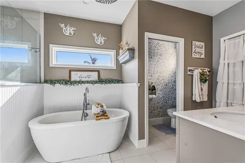 a bathroom with a bathtub and a sink
