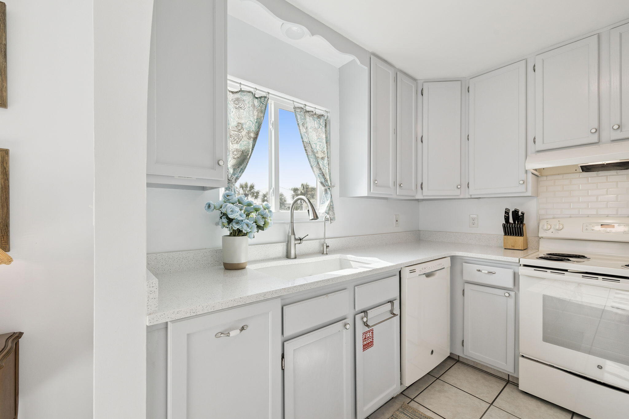 448 West Park Pl Avenue, Unit A2 Inlet Beach, FL 32461 - Photo 11 of 54 a kitchen with white cabinets and white appliances
