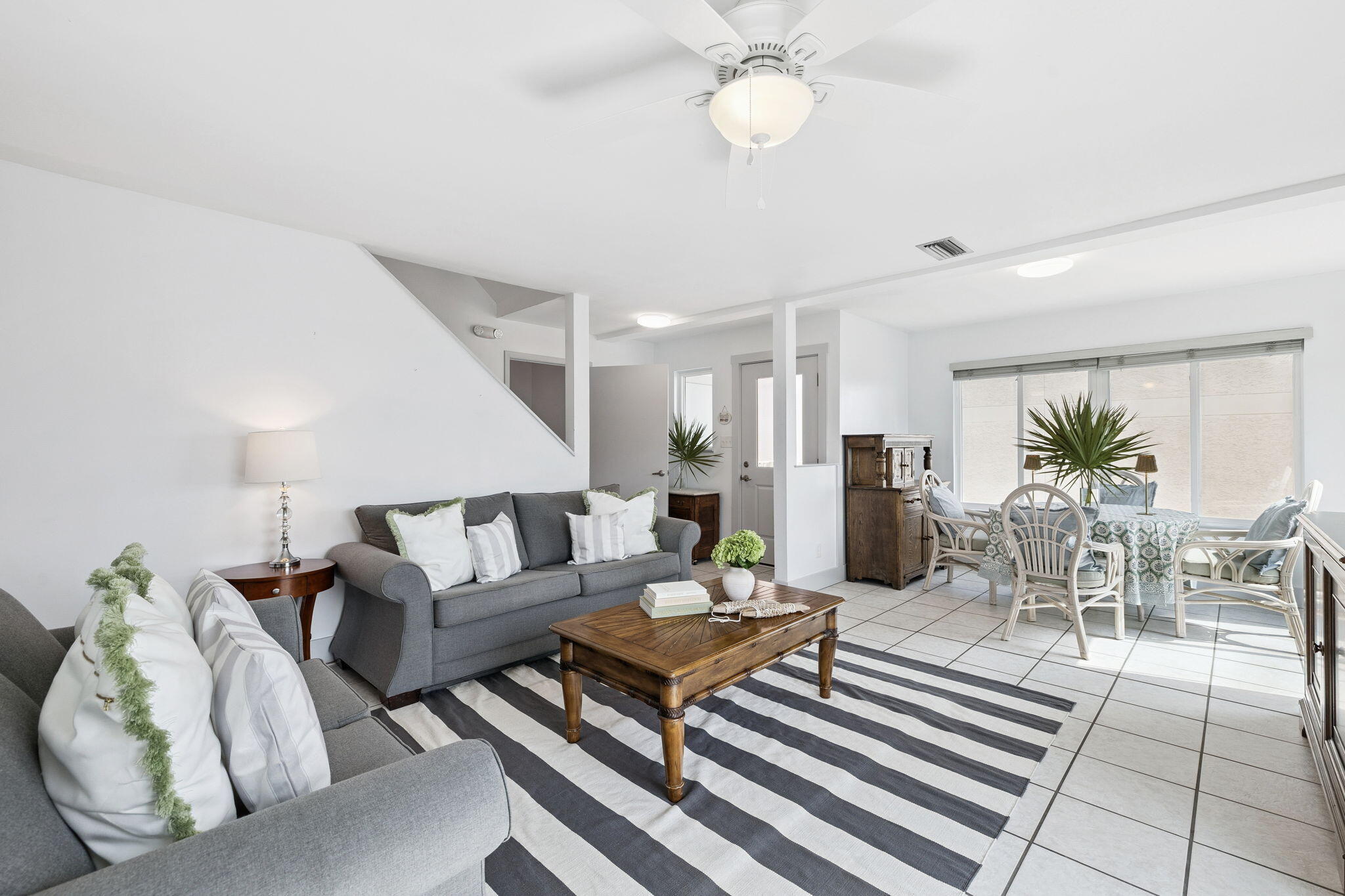 448 West Park Pl Avenue, Unit A2 Inlet Beach, FL 32461 - Photo 14 of 54 a living room with furniture and a chandelier