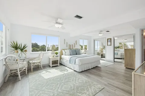 a large white bed in a white room