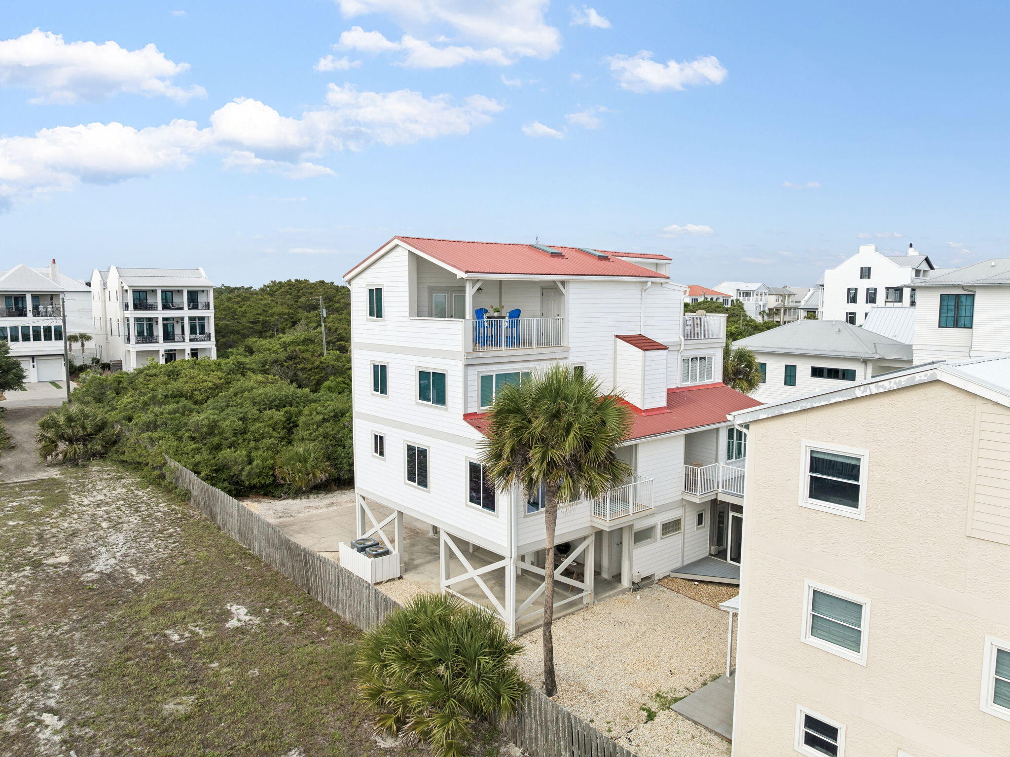 448 West Park Pl Avenue, Unit A2 Inlet Beach, FL 32461 - Photo 2 of 54 a view of a patio with table and chairs and potted plants