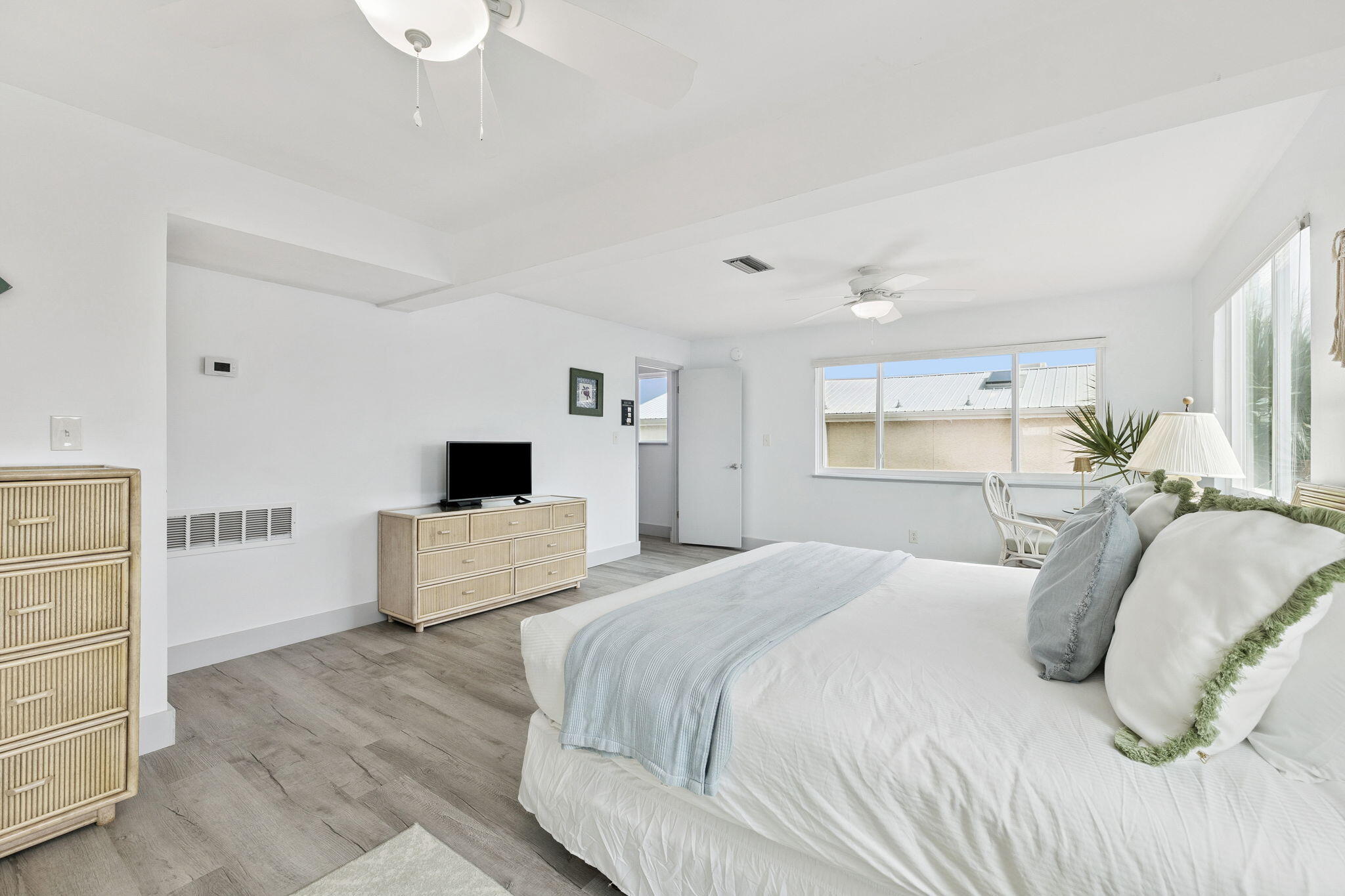 448 West Park Pl Avenue, Unit A2 Inlet Beach, FL 32461 - Photo 23 of 54 a bedroom with a bed and a couch