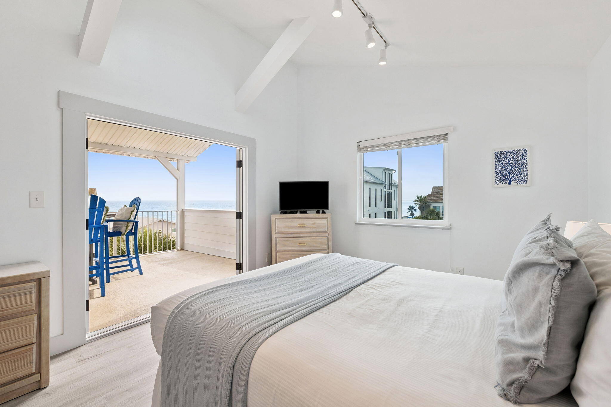 448 West Park Pl Avenue, Unit A2 Inlet Beach, FL 32461 - Photo 26 of 54 a bedroom with a bed and a flat screen tv